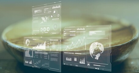 Wall Mural - Translucent digital interface panels showing data charts and world map above wooden bowl in studio