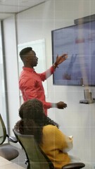 Wall Mural - Animation of data processing over diverse business people in office