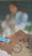 Wall Mural - Animation of financial data processing over businessman using smartphone