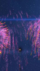 Canvas Print - Animation of exploding fireworks and glowing light trails moving over blue background