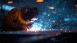 © Biancaart - Intense Welding Sparks: Industrial Worker in Protective Gear Creating Fiery Showers