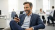 © hobonski - Smiling Businessman Using Smartphone in Modern Office. Confident businessman in a suit smiling while using his smartphone in a bright modern office, reflecting communication, success.