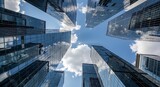 Towering city skyscrapers stretch toward clouds, emphasizing business growth and modern architectural design in an urban skyline