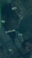 Wall Mural - Animation of data processing over asian businessman in server room
