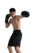 © Adobe Contributor - A shirtless man in boxing gloves is captured in a punching motion, showcasing athleticism and physical strength.