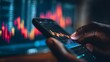 © JoaoNalio - Analyzing stock market data on a smartphone, close-up of hand and phone screen