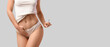 © Pixel-Shot - Beautiful young woman in underwear holding syringe on light background with space for text, closeup. Female cosmetic genital surgery (fcgs) concept