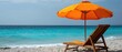 © kvladimirv - Tranquil Beach Scene with Orange Umbrella and Wooden Lounge Chair by the Ocean