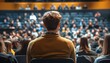 © Studicon - Attentive man in the audience at a conference