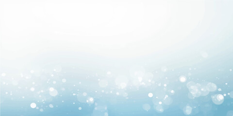 Wall Mural - Bright, glowing abstract blue background with bokeh light, perfect for a winter holiday or Christmas design backdrop featuring blurred snow