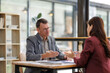 © crizzystudio - Business colleagues discussing project ideas in office meeting
