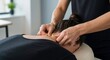 © D-point - Woman receiving massage from a therapist for neck pain relief. Healthcare and wellness concept. Alternative medicine.