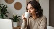 © Tita - Woman enjoying morning coffee indoors