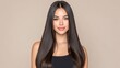 © 69 - Beautiful woman with long, straight hair and natural makeup against a neutral background, conveying beauty, confidence, and simplicity in a portrait setting