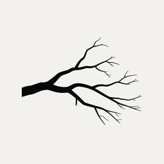 Silhouette of a bare tree branch against a light background