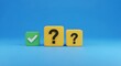 © Wool World - Decision-Making Process Green Checkmark and Yellow Question Mark Cubes Symbolizing Choices, Answers, and Uncertainty in a Minimalist 3D Render