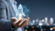 © kaliel - Digital rocket launching from a hand, illustrating a startup going live and the concept of networked innovation fueled by data and teamwork