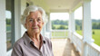 © Svetlana Leuto - Serene portrait of an elegant elderly woman in front of her white country house, embodying the concept of a peaceful rural lifestyle for retirees. Includes copy space for messaging