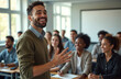 © Viktor - Teacher stands in classroom giving lesson to college students. Male professor speaks to young adult learners. Diverse group of students sit at desks, listen, smile. Education setting with whiteboard,