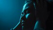 © Jojo* - Person holding head in blue light shows distress.