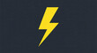 © Suliman - Yellow lightning bolt on a dark gray background symbolizes power, energy, speed, and electricity in a simple and striking graphic design
