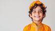 © Kanlayarawit - Happy and smiling Indian boy wearing prince costume, isolated on plain white background with copy space for text.