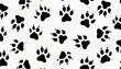 © miss irine - Seamless pattern of black paw prints on a white background. Animal tracks of various sizes suggest dogs cats and big cats. Useful for pet related themes.