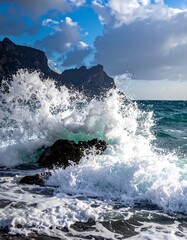  Coastal scene captures a powerful ocean wave crashing against rocky cliffs under a dramatic sky