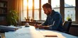 © Chanchai - A focused architectural designer sketching building plans on a large desk, surrounded by blueprints and design tools Sunlight streams in through a nearby window , modern, drawing