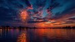 © mila103 - A beautiful sunset over a body of water with fireworks in the sky. The fireworks are lit up in the sky and the water is calm