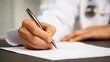 © suyu - Doctor's hand writing medical notes on blank paper during patient consultation, capturing professional healthcare moment with clinical precision in medical setting