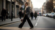 © Lexi - Confident woman walking on street in business attire during the day
