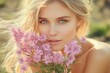 © Aleksandra - Close-up portrait of a blonde woman with blue-green eyes holding a bouquet of vibrant pink flowers, bathed in soft natural sunlight, evoking a serene and elegant mood