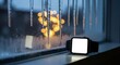 © ZHMPRO - Smartwatch with blank screen on a windowsill with icicles and blurred christmas lights outside