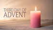 © Alfaz - Third day of advent a single lit pink candle glows softly on a wooden surface symbolizing hope and anticipation during the christmas season