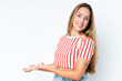 © luismolinero - Young caucasian woman isolated on white background extending hands to the side for inviting to come