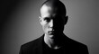© pradi - Intense Black and White Portrait of a Young Man with a Serious Expression.