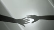 © blacksalmon - Shadow of Two Hands trying to Reaching each others. Helping Hand. Support, Partnership