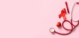 Red ribbon with stethoscope, blood sample and heart on pink background with space for text. Blood Cancer Awareness Month