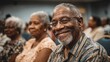 © Snowstudio - Elderly black man smiling in audience at community center event