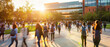 © petrrgoskov - A large group of students walking across a modern university campus during sunset. Warm sunlight, urban architecture, and dynamic motion create an academic and vibrant atmosphere.