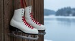 © MUMIMA - Vintage Ice Skates with Red Laces Hanging on Wooden Wall – Winter Sports and Holiday Nostalgia Concept