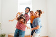 © TrueShot | Westend61 - Happy family having fun together at home