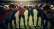 © Nique - Team huddle before the match, unity and teamwork concept