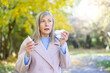 © Liubomir - Senior woman suffering from autumn allergy holding nasal spray