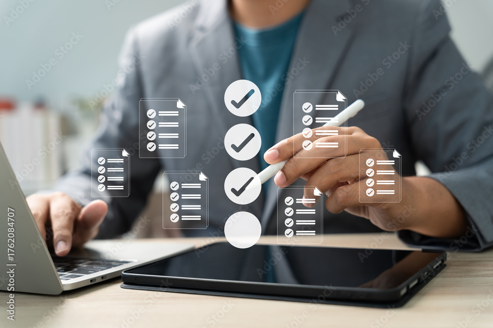 Task management and digital checklist concept. Businessman using stylus ...
