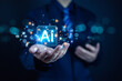 © C VrStudio - Futuristic concept of artificial intelligence and digital technology in business. Businessman holding glowing AI icon with data analytics, innovation, and machine learning network background.