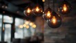 © Thares2020 - Warm ambient lighting from decorative hanging glass bulbs creates a cozy atmosphere in a stylish cafe interior
