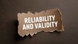 © Muhammad - Reliability and validity concept on torn paper against a dark background for quality assurance and trustworthy data