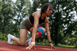 © Nikola Spasenoski - Fitness woman preparing for a run outdoors with kinesiology tape support